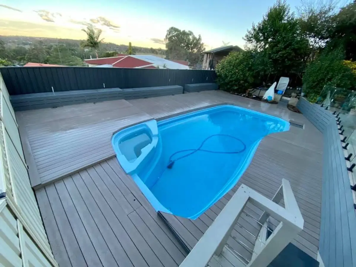 Pool surround with frameless glass fencing